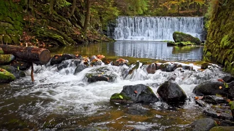 Mountain river with a cascade, cold water flows through the riverbed betwee.. Stock Footage 273594958