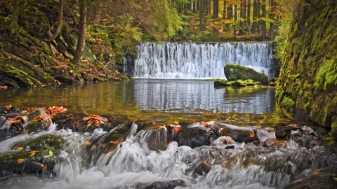 Mountain river with a cascade, cold water flows through the riverbed betwee.. Stock Footage 273595541