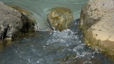 Mountain river cascades through rocks Video stock 336795768