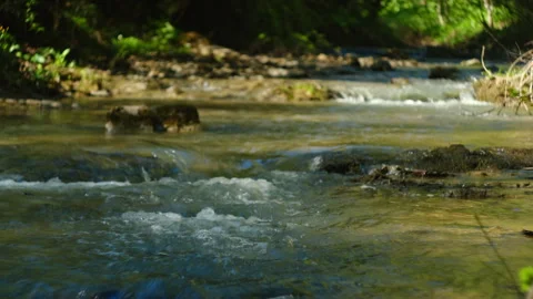 Mountain river cascading through rocky terrain at spring day Stock Footage 326878225