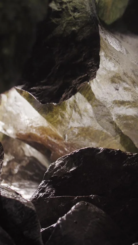 A mountain river in a cave. Waves and rocks. Vertical format. Stock Footage 320997954