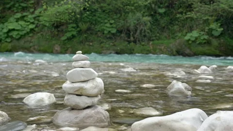 Mountain river with clear water and a cairn. Relax, rest and relaxation in Stock Footage 153528910