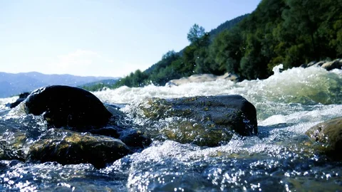 Mountain river close up against the background of mountains 4K video Stock Footage 95017817