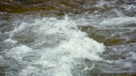 Mountain river close up water slow motion Stock Footage 73812385