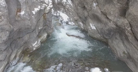 A mountain river cut through a rock. charming winter view Stock Footage 95573319
