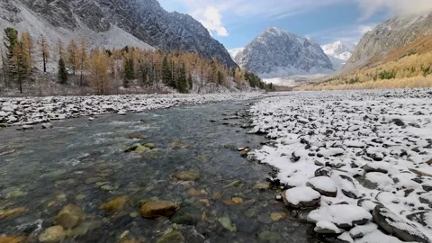 Mountain river at dawn in autumn, the first snow. Stock Footage 164249065