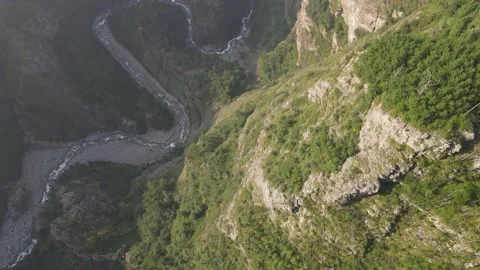 Mountain river in a deep gorge. Aerial view down. Stock Footage 170043487