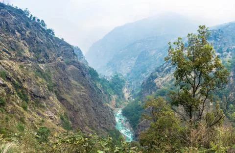 Mountain river in a deep gorge in the Himalayas. Stock Photos