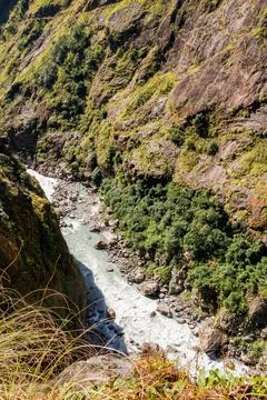 A mountain river in a deep gorge. Stock Photos