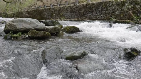 Mountain river finding its way thru big rocks Stockbeeldmateriaal 88810361