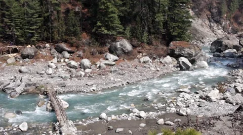 Mountain river flowing among big rocks in forest Video stock 67646260