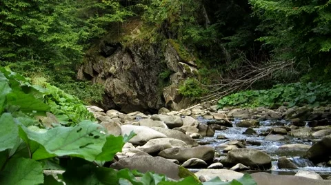 Mountain river flowing between large stones Stock Footage 68807136