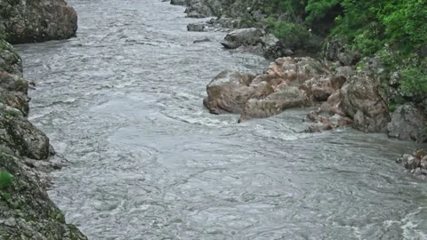 Mountain river flowing in a canyon in springtime Stock Footage 243747286