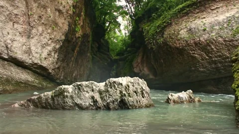 Mountain river flowing in a canyon in springtime Stock Footage 243757733