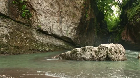 Mountain river flowing in a canyon in springtime Stock Footage 243757776