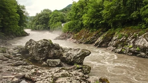 Mountain river flowing in a canyon in springtime Stock Footage 243758395