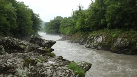 Mountain river flowing in a canyon in springtime Stock-Footage 243760504