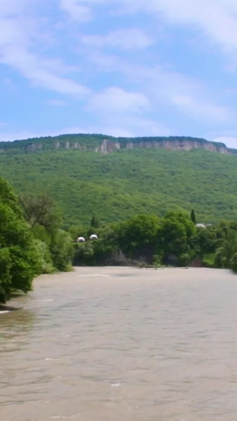 Mountain river flowing in a canyon in springtime Video stock 244072711