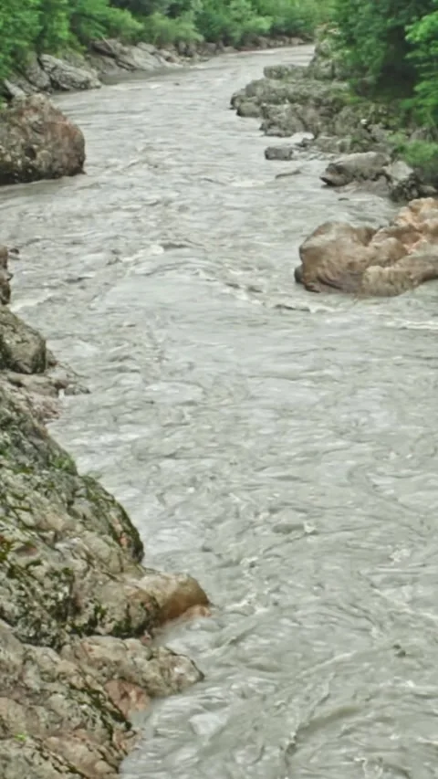 Mountain river flowing in a canyon in springtime Video stock 244074137