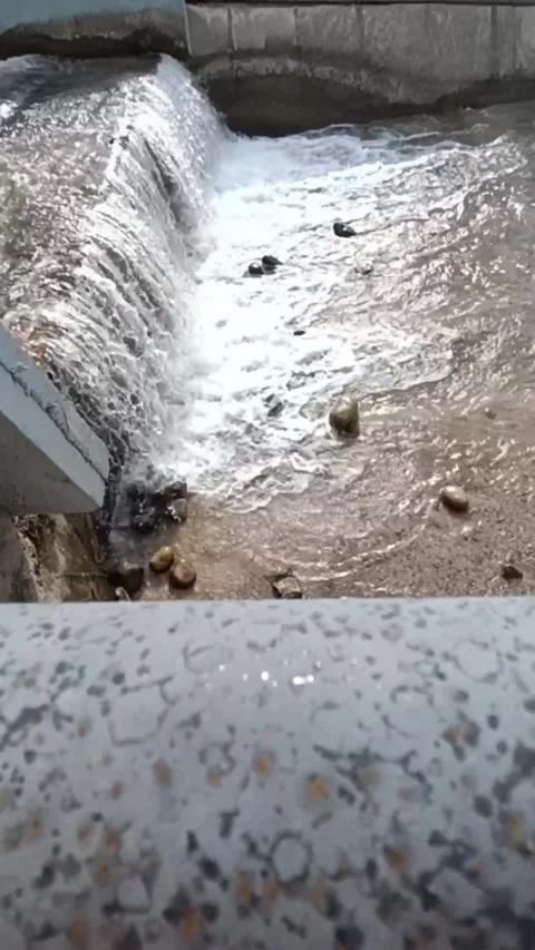 Mountain River Flowing in Concrete Channel Stock Footage 332866295