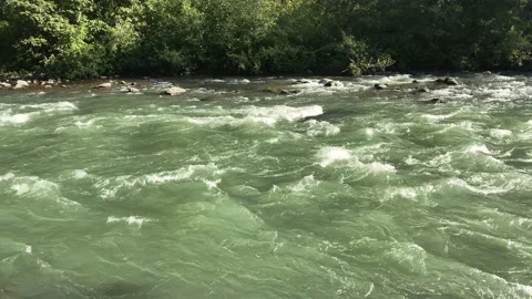 Mountain river flowing fast with white heads Stock Footage 214421790