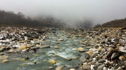Mountain river flowing Himalayas Nepal. Water in rocks. Snow fog nature hd video Stock Footage 64829154