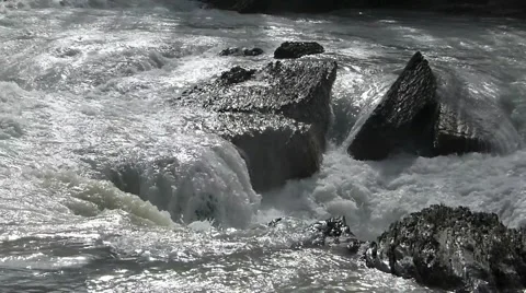 Mountain River Flowing Over Rocks in the Sun Stock Footage 41416915