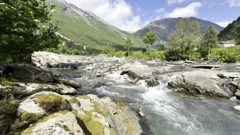 Mountain river flowing over rocks in the norwegian Видео 340238152