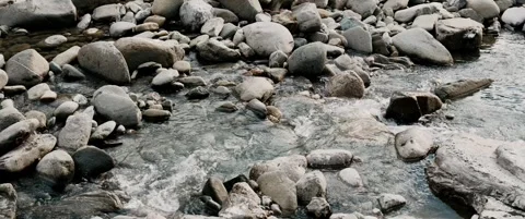 Mountain river flowing over rocky streambed. Stock Footage 328934872