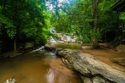Mountain river flowing into pool. Stock Photos
