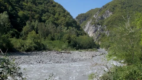 Mountain river flowing through green valleys in Racha Georgia Stock Footage 294946096