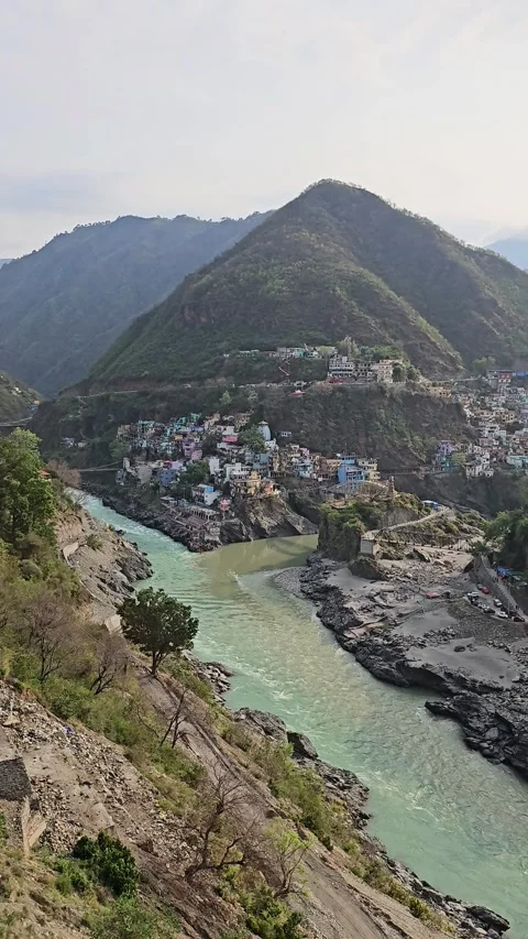 Mountain River Flowing Through Himalayan Valley with Riverside Town Stock Footage 343672521