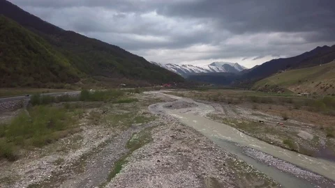 Mountain River Flowing through the Stone Plateau, View of Snow Capped Peak Stock Footage 129323640