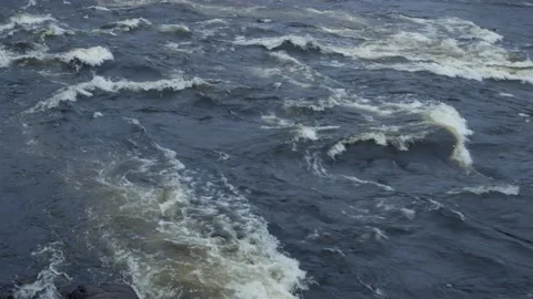 The mountain river flows along the rapids. Autumn with orange leaves. Stock Footage 164593917