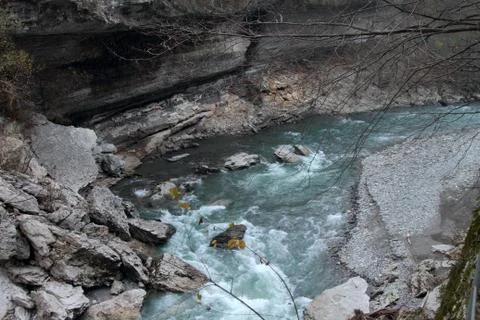 The mountain river flows among the cliffs in the Khadzhokhskaya gorge. Stock Photos