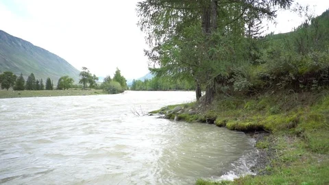 Mountain river flows among the mountain landscape Video stock 120726174