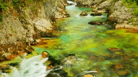 The mountain river flows among stones, water texture Video stock 64963842