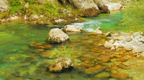 The mountain river flows among stones, water texture Stock Footage 64964053