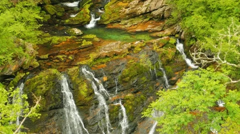The mountain river flows among stones, water texture Stock-Footage 65052560
