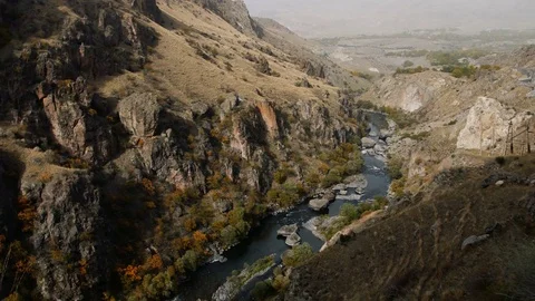 Mountain river flows between huge rocks 스톡 동영상 83739934