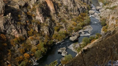 Mountain river flows between huge rocks Stock Footage 83740322