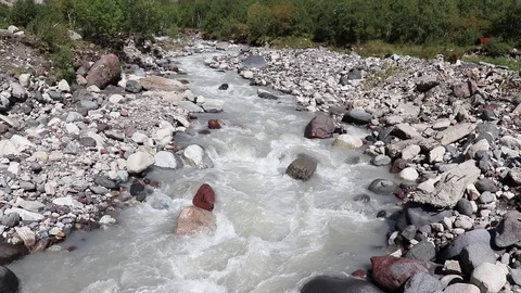 Mountain river flows between stones Stock Footage 118251873