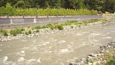 A mountain river flows down. Beautiful view of the mountains and the river Video stock 161719155