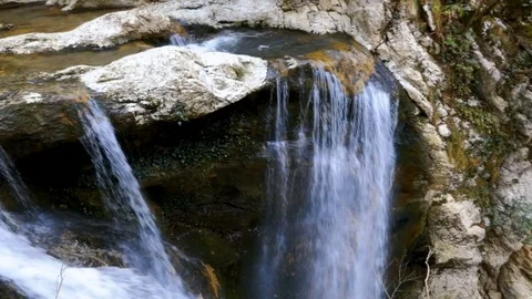 Mountain river flows down from  cliff 스톡 동영상 85238163