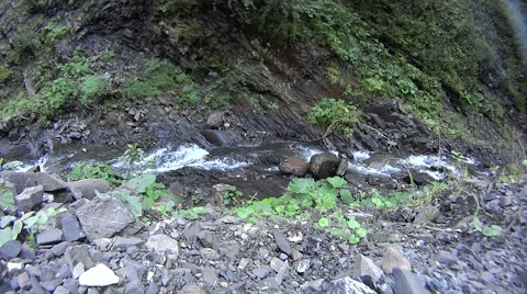 Mountain river flows near high rocks in a canyon Stock-Footage 54302158