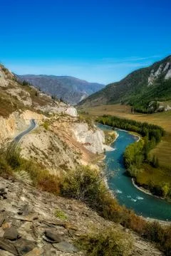 Mountain river flows over the rocks. The rivers are altai. Nature is altai. Stock Photos