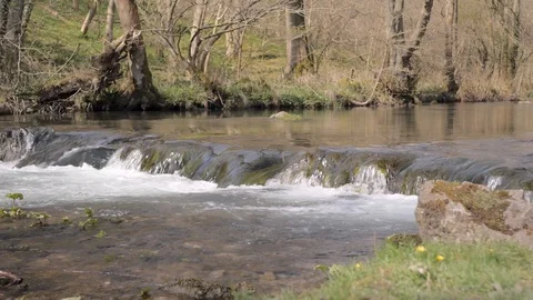 The mountain river flows over the threshold Stock Footage 106777078