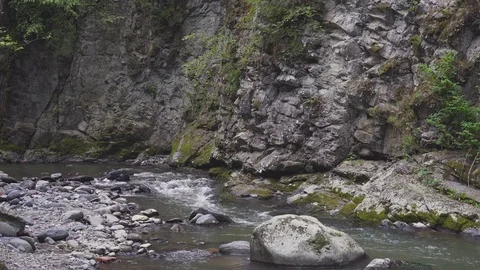 The mountain river flows rapidly Stock Footage 80398882
