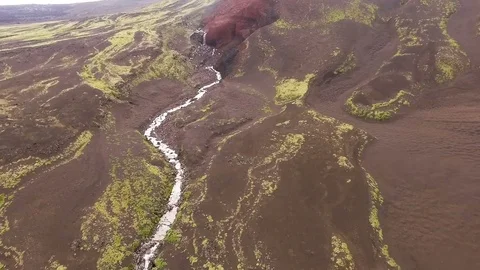 Mountain river flows into a waterfall Stock Footage 72655604