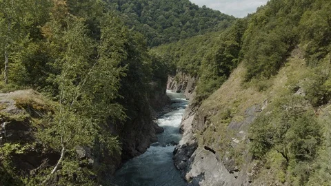 Mountain river goes through the granite canyon Stock Footage 112733742
